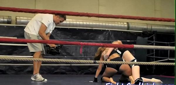  Muscular women wrestling in a boxing ring